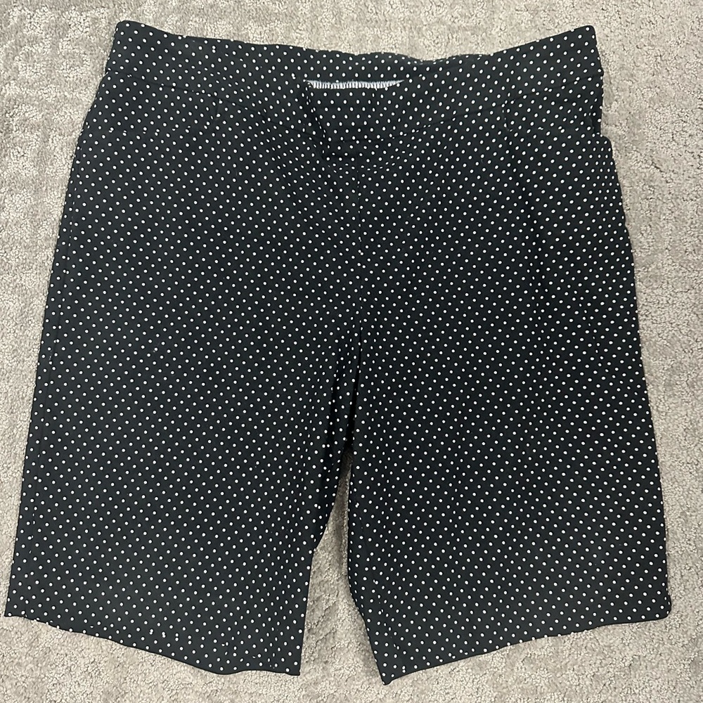 Size 14 stretchy classic black with white polkadot shorts. Two pockets.